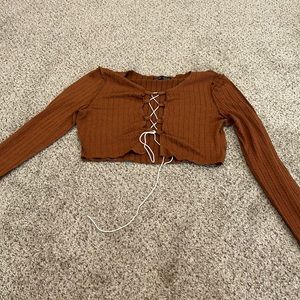 Long sleeve brown cropped top. Never worn!